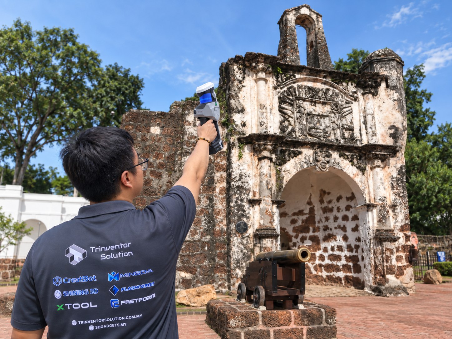 Engineer capturing a historic stone gateway on site with a handheld mobile 3D scanner
