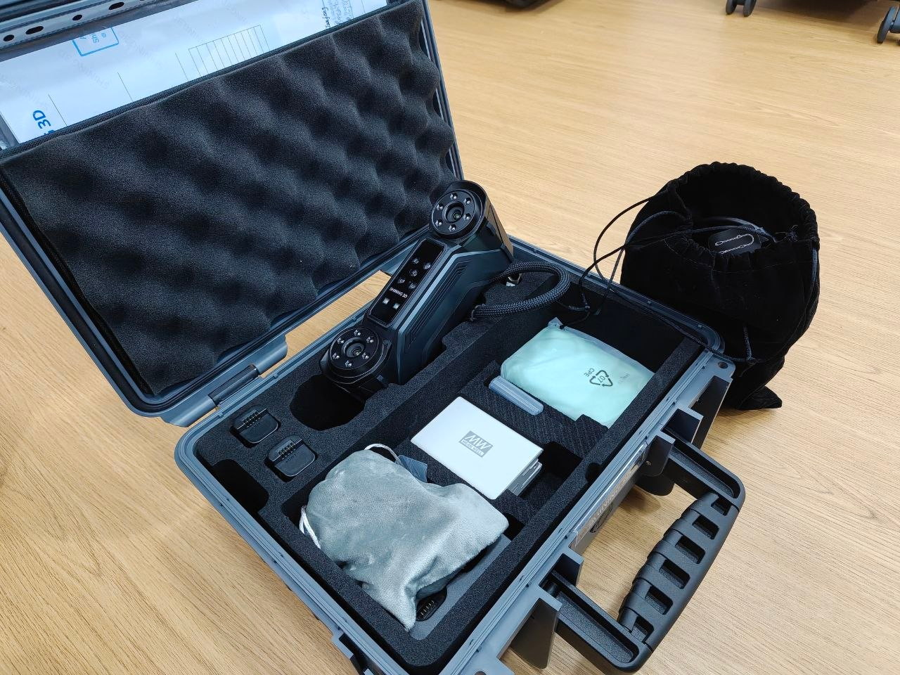 FreeScan handheld scanner in its case with the soft pouch, dongle box, targets, wipes and calibration documents