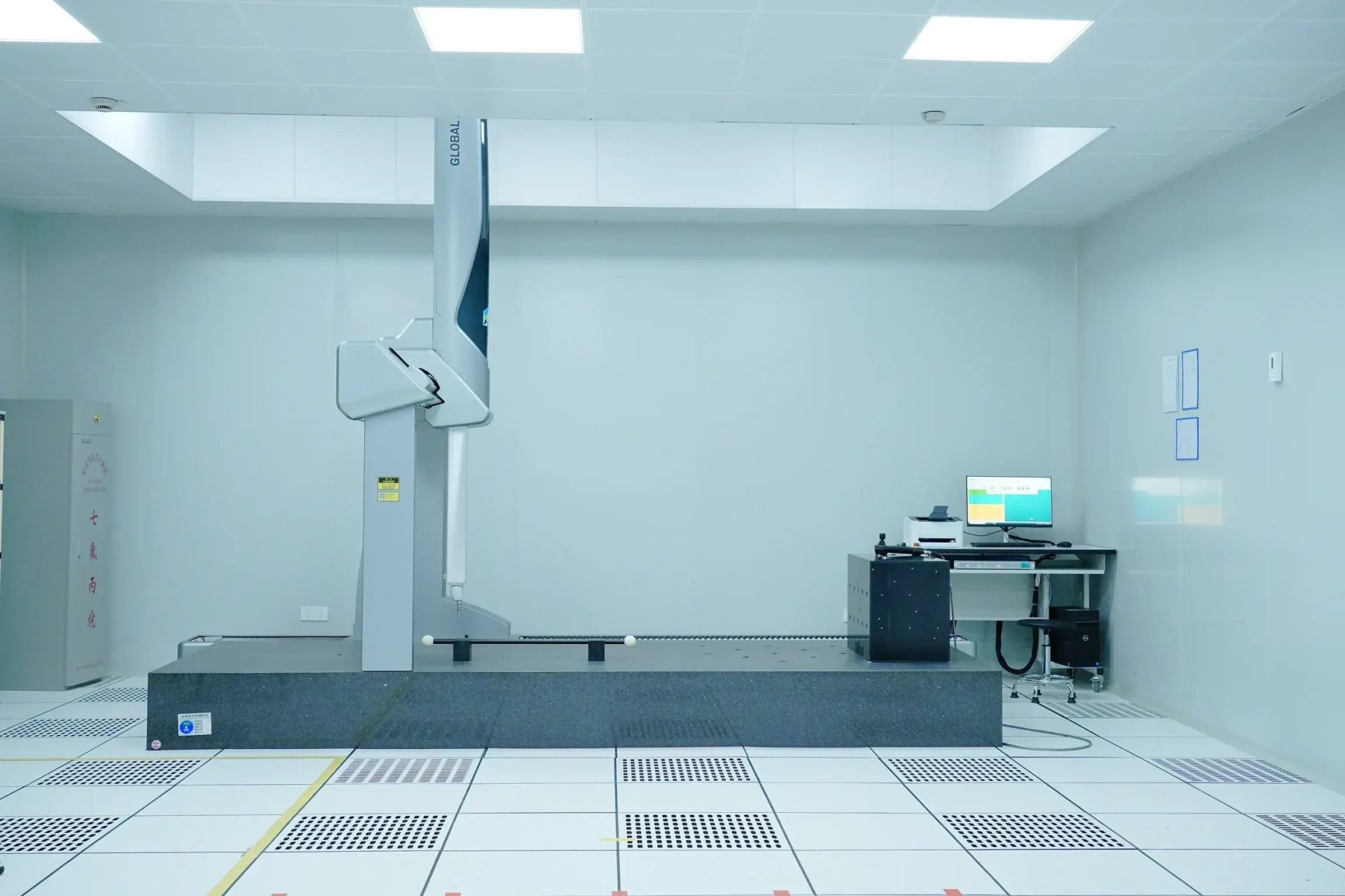 Bridge coordinate measuring machine (CMM) in a temperature-controlled measuring room