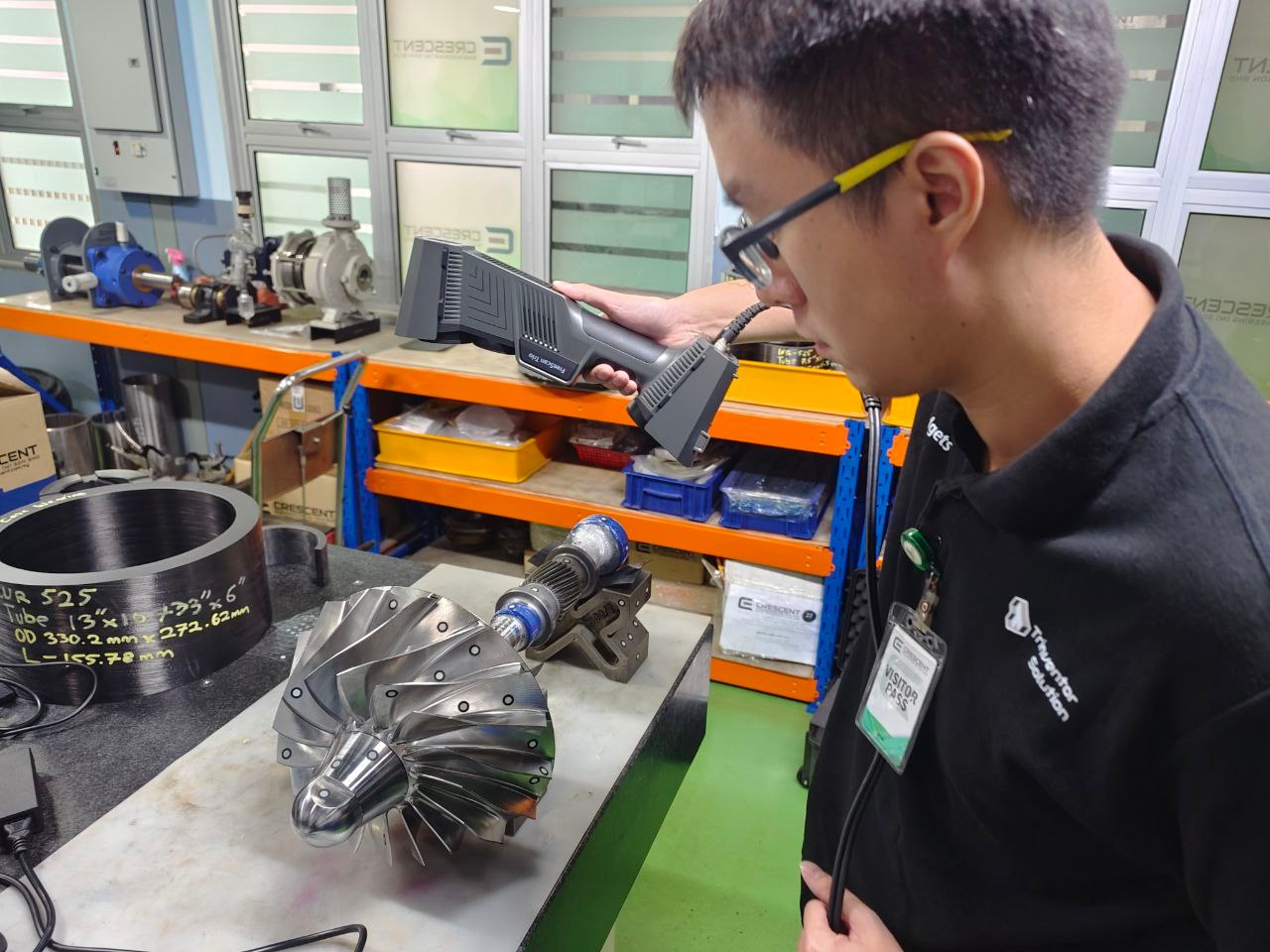 Handheld 3D scanner capturing a stainless impeller rotor during a 3D scanning job in Malaysia