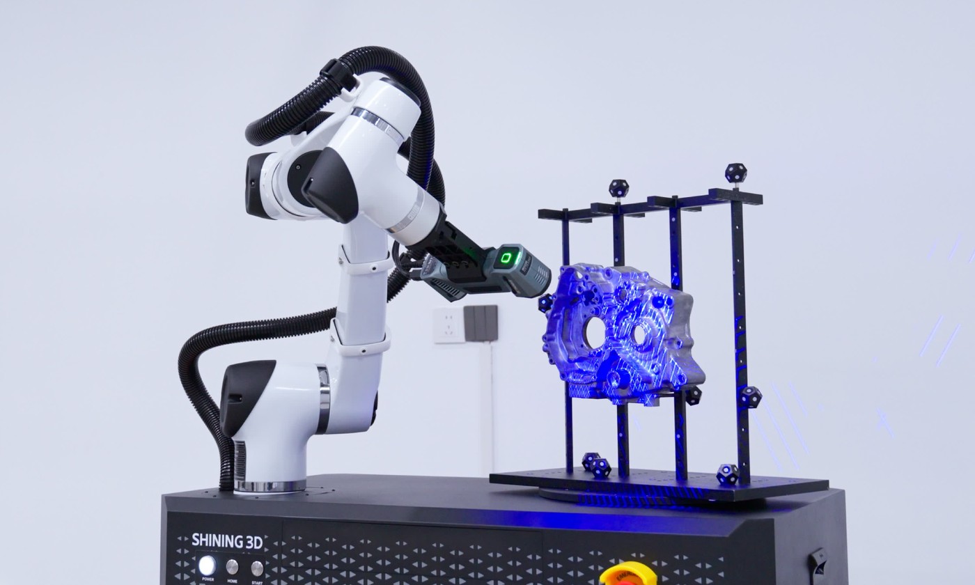 Robot-mounted 3D scanner scanning a part on a rotary table