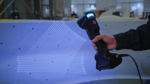 Blue laser lines scanning a large mold for 3D inspection