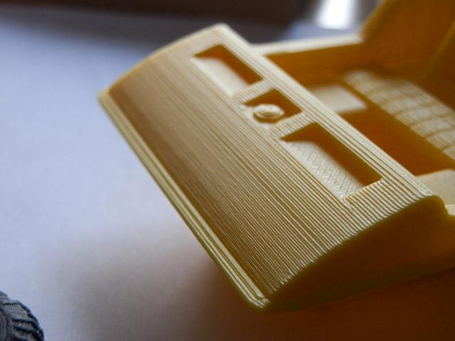 An ABS print with a shallow sloped face where each layer step is visible, showing the staircase effect and why orientation affects surface finish