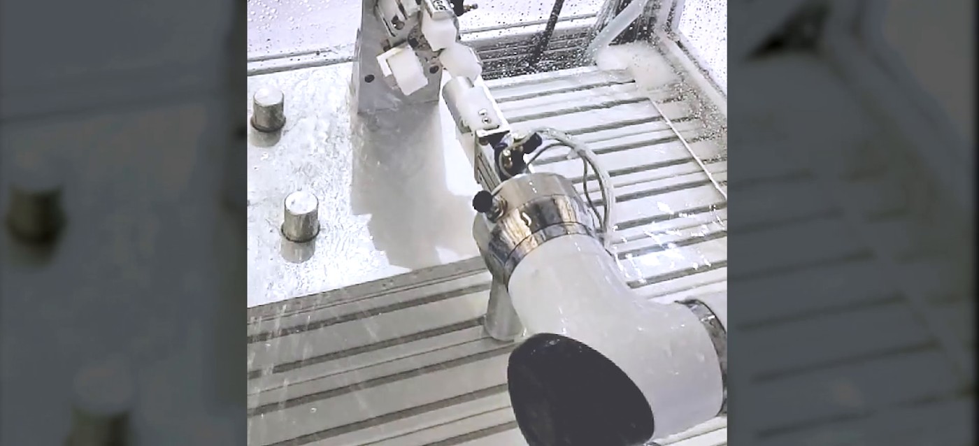 Collaborative robot loading parts at a machine fixture