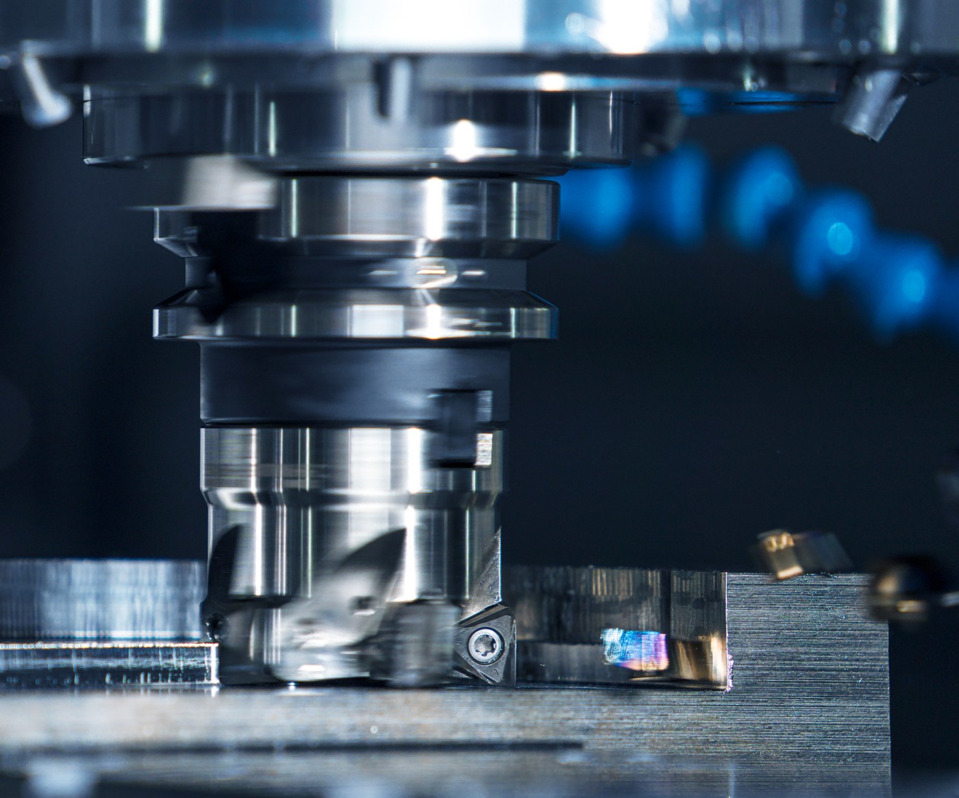 CNC machining close-up with coolant and cutting tool
