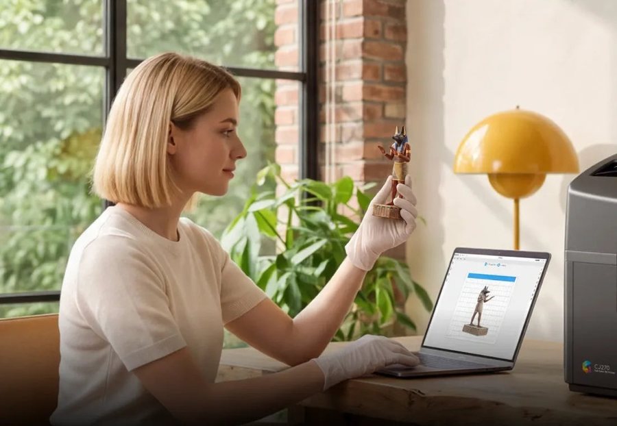 Creative enthusiast working at home with a small full-colour print from the FlashForge CJ270