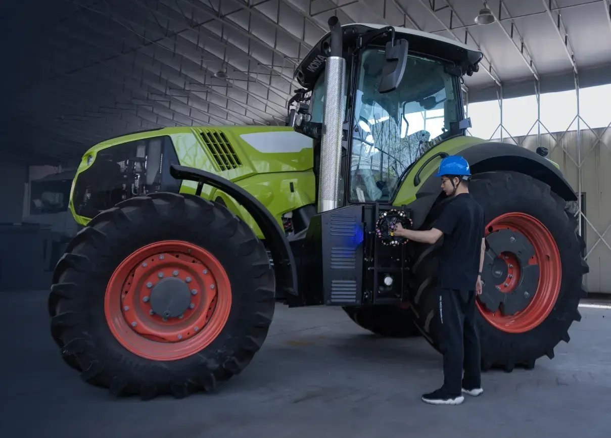 Agricultural machinery being digitised with a handheld 3D scanner