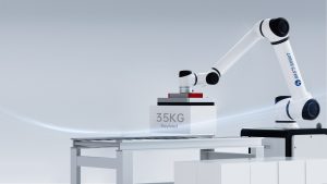 Collaborative robot lifting a 35 kg payload box in a demonstration cell