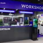 An xTool Retail Studio in-store workshop counter with engraving machines and personalised products on display