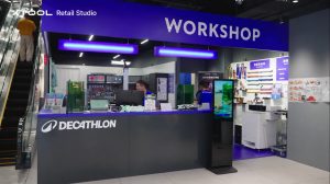An xTool Retail Studio in-store workshop counter with engraving machines and personalised products on display